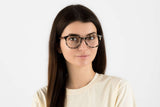 Woman wearing Faith Ivory, Ivory Tortoise Geometric Glasses