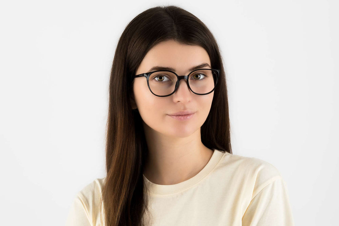 Woman wearing Serene Black, Oval Black Acetate Glasses